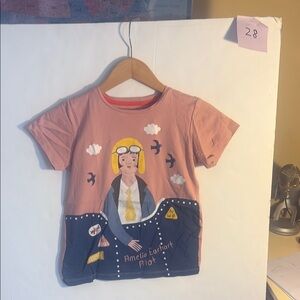 Whimsical Amelia Earhart Pink and Blue Short Sleeve Tee with Space Design